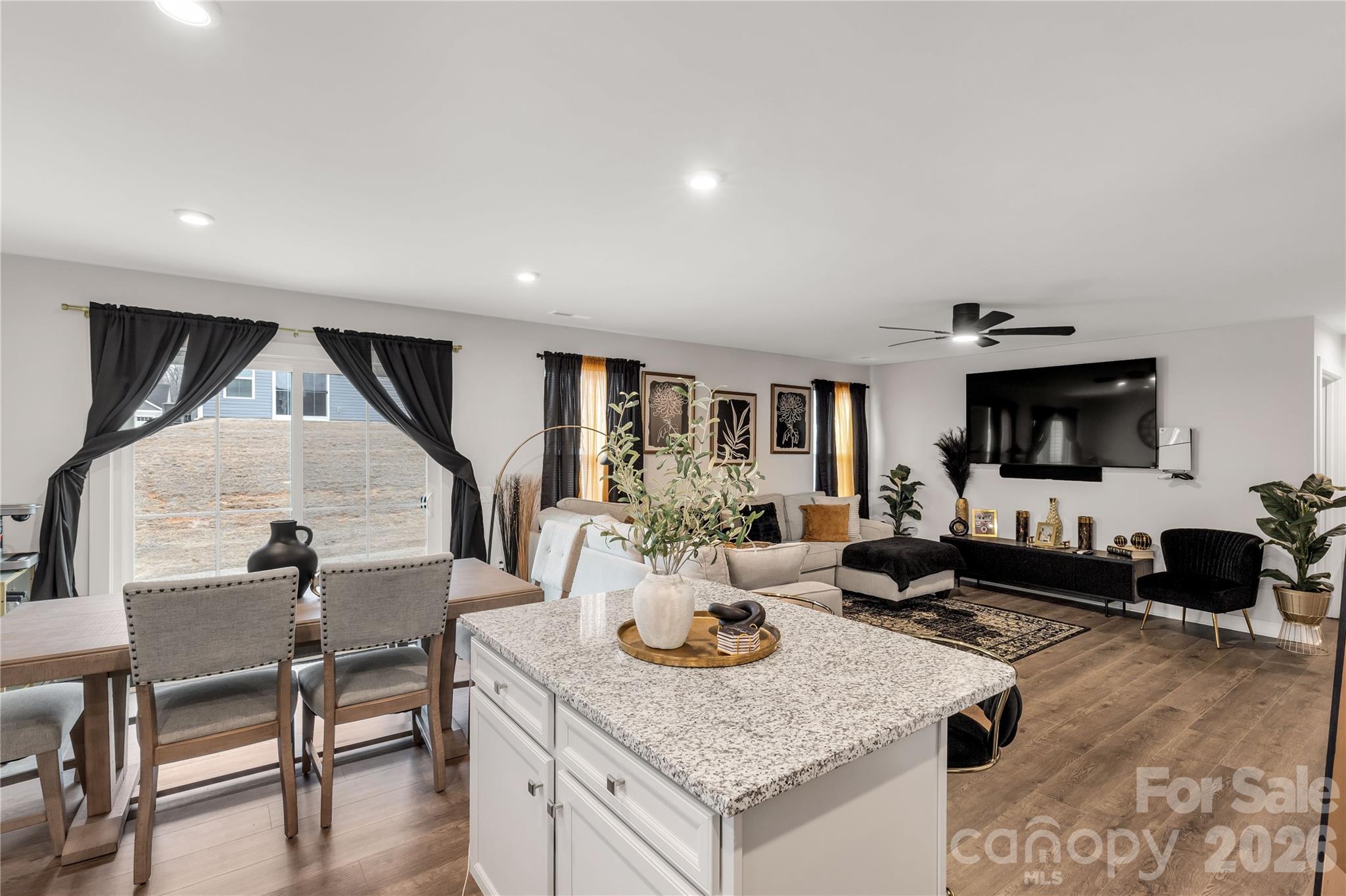 810 Purslane Street Lancaster, SC 29720 - Photo 10 of 24 a living room with furniture and a wooden floor