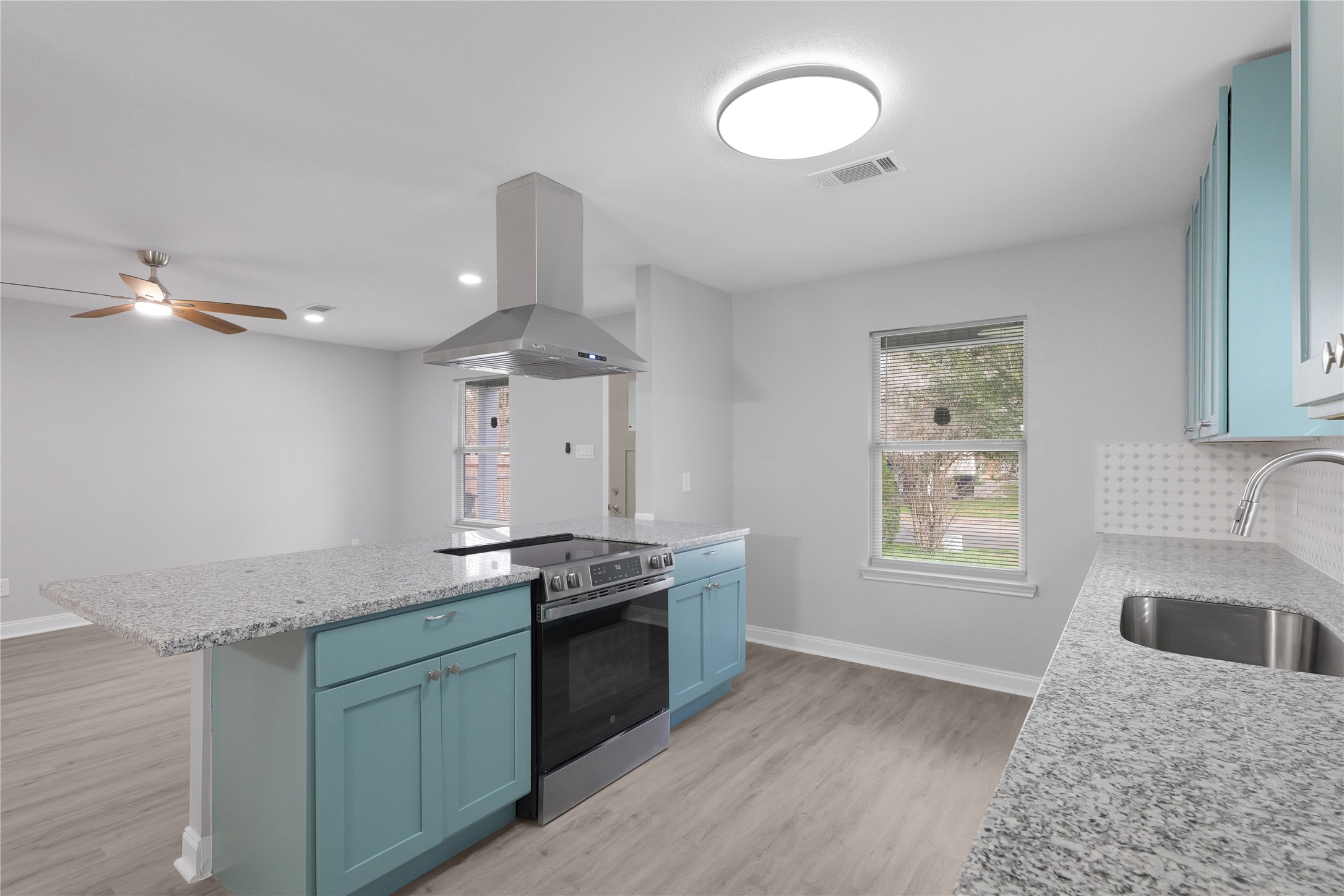 9827 Shive Drive Houston, TX 77078 - Photo 1 of 15 a kitchen with stainless steel appliances granite countertop a sink stove and refrigerator