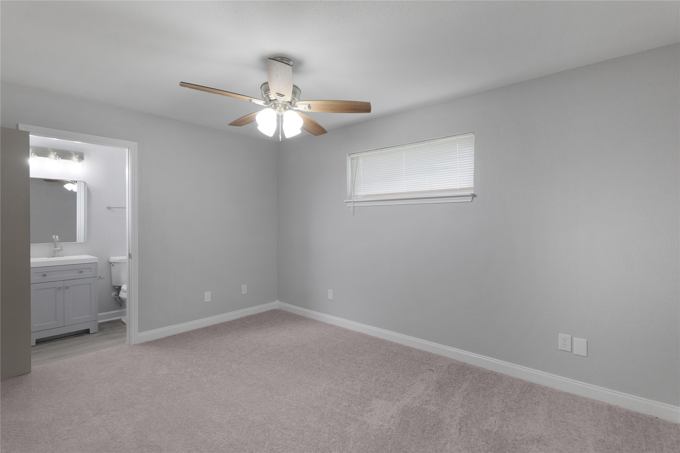 9827 Shive Drive Houston, TX 77078 - Photo 15 of 15 wooden floor in an empty room with a bathroom