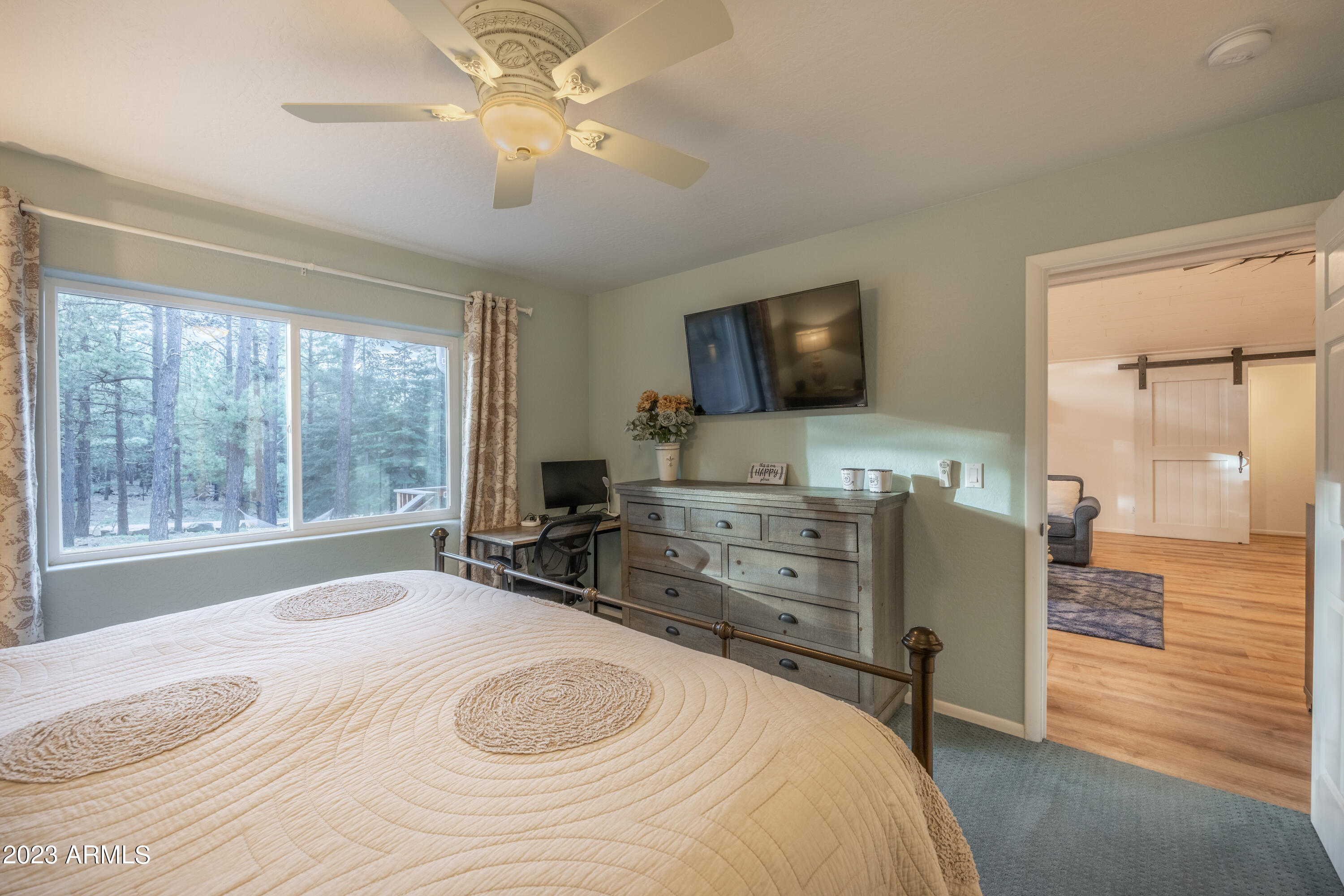 2772 Larson Loop Forest Lakes, AZ 85931 - Photo 19 of 65 a bedroom with a bed and a flat screen tv