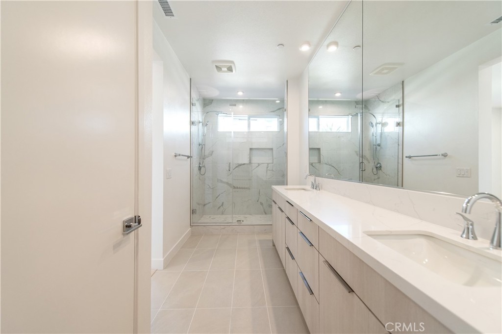 2604 Everly Drive San Diego, CA 92108 - Photo 15 of 33 a bathroom with a double vanity sink mirror double and shower