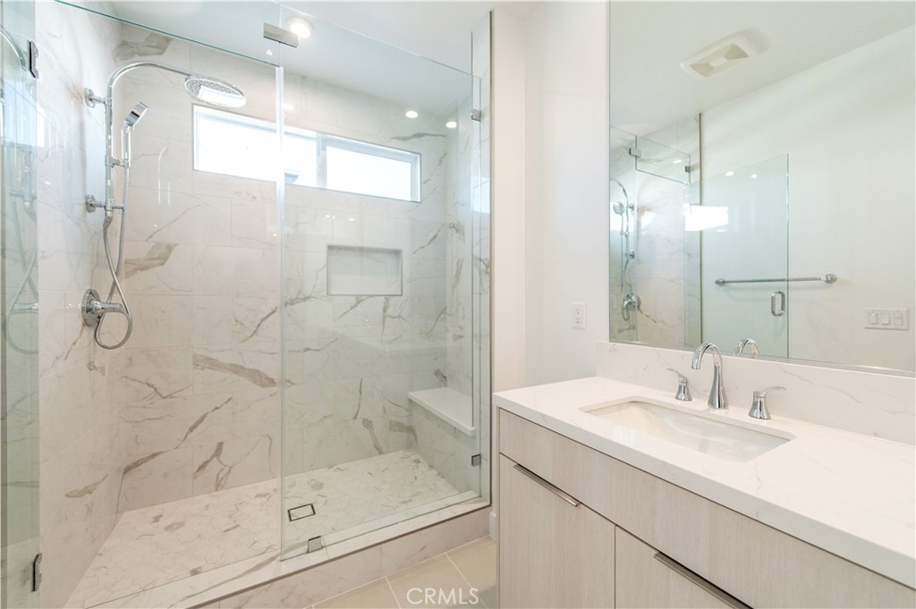 2604 Everly Drive San Diego, CA 92108 - Photo 16 of 33 a bathroom with a shower sink and mirror