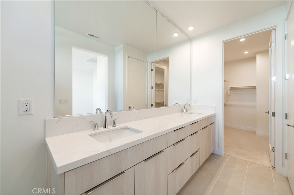 2604 Everly Drive San Diego, CA 92108 - Photo 17 of 33 a bathroom with a sink double vanity and a mirror