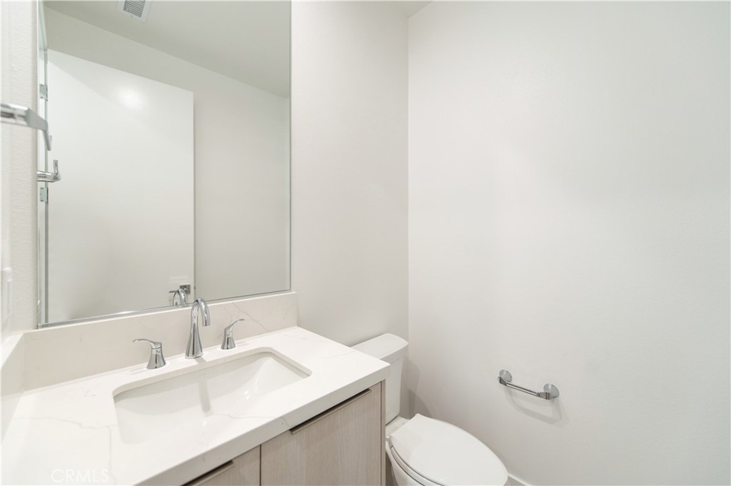 2604 Everly Drive San Diego, CA 92108 - Photo 26 of 33 a bathroom with a sink vanity mirror and toilet