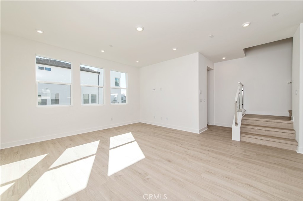 2604 Everly Drive San Diego, CA 92108 - Photo 27 of 33 an empty room with wooden floor and windows