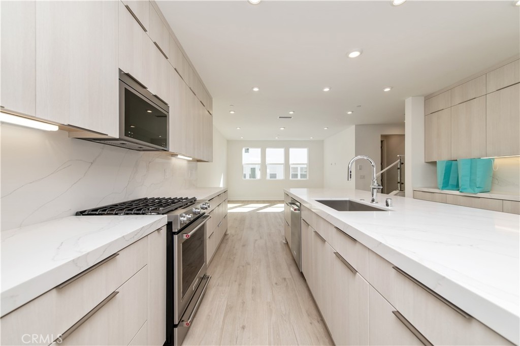 2604 Everly Drive San Diego, CA 92108 - Photo 7 of 33 a kitchen with a sink stove and microwave