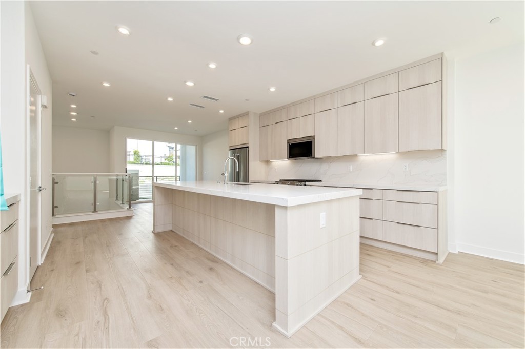 2604 Everly Drive San Diego, CA 92108 - Photo 8 of 33 a kitchen with white cabinets and appliances