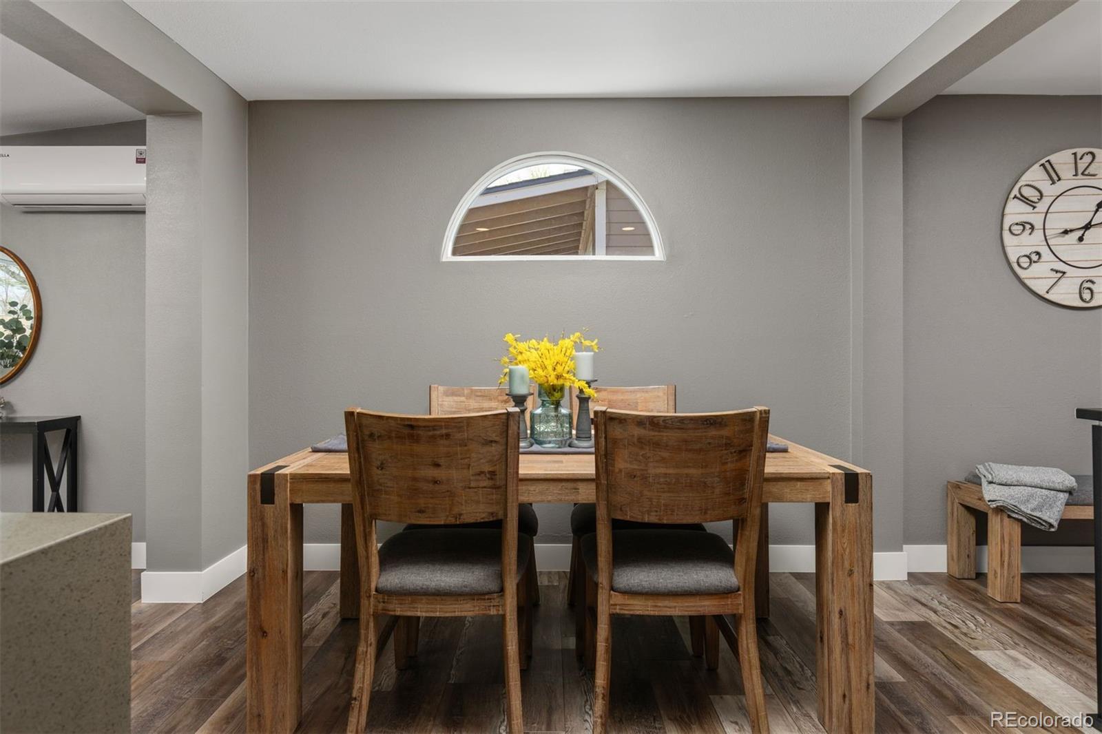 3692 South Mobile Way Aurora, CO 80013 - Photo 14 of 48 a dining room with furniture and wooden floor