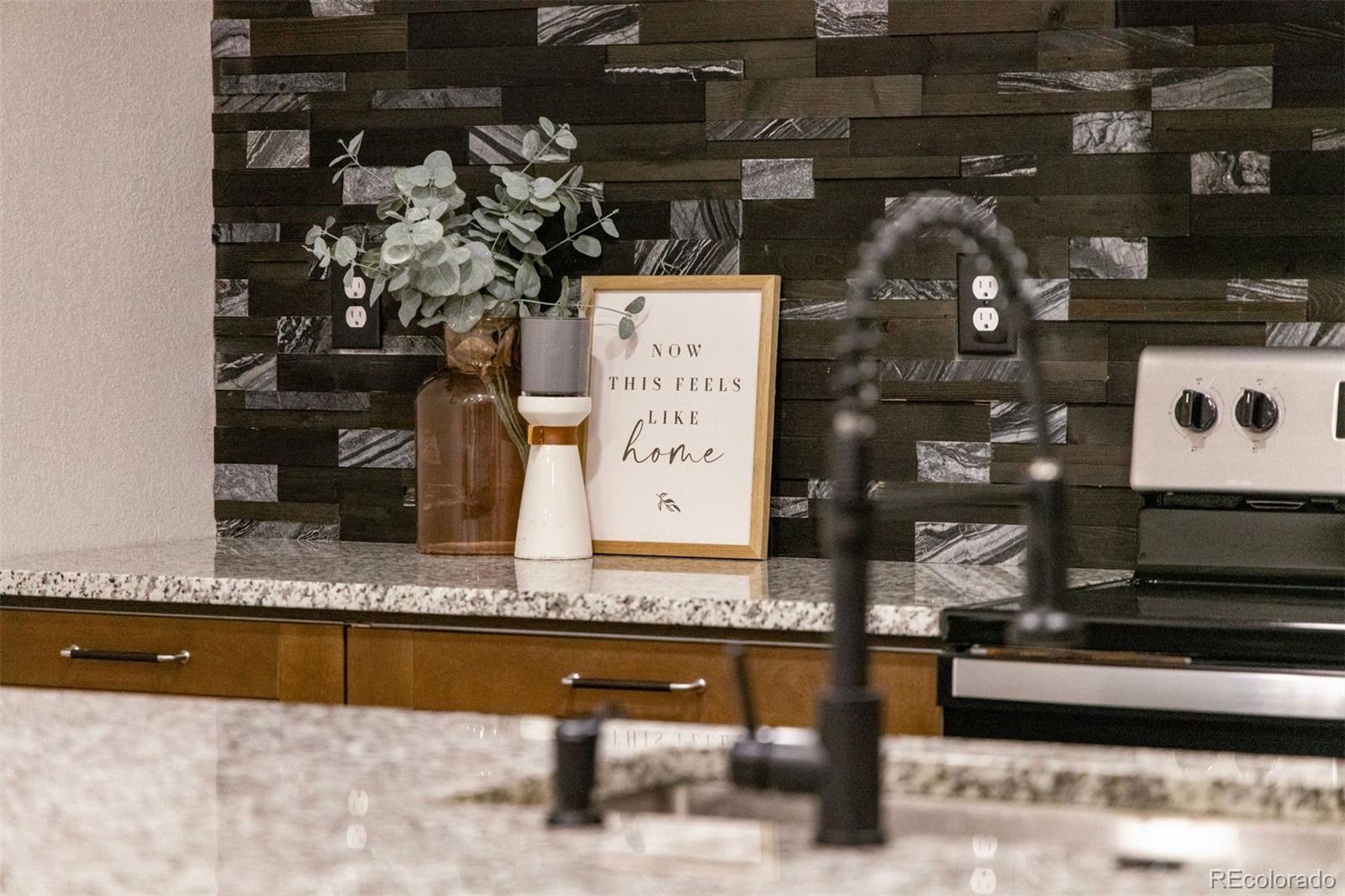 3692 South Mobile Way Aurora, CO 80013 - Photo 29 of 48 a picture of a counter top space with furniture