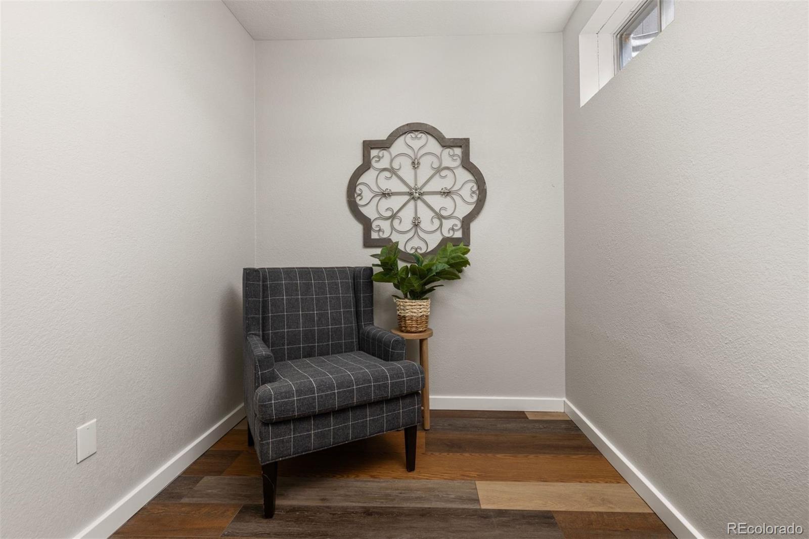 3692 South Mobile Way Aurora, CO 80013 - Photo 35 of 48 a living room with furniture and a potted plant
