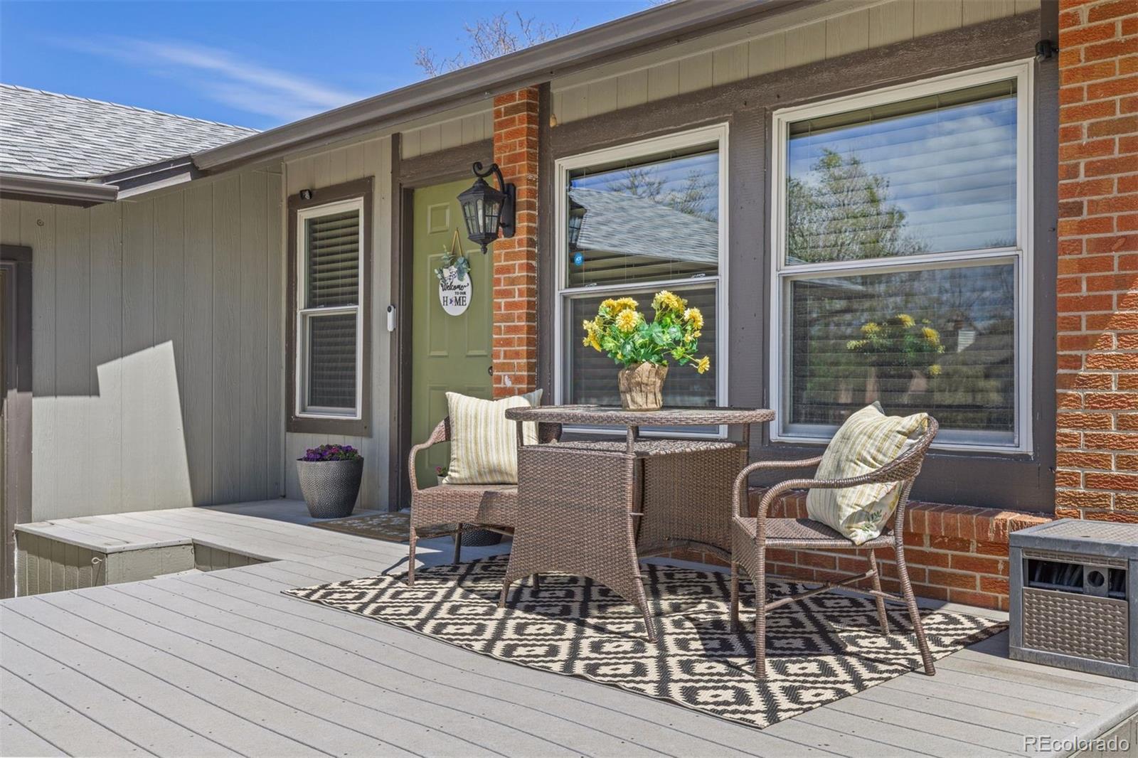 3692 South Mobile Way Aurora, CO 80013 - Photo 4 of 48 a balcony with table and chairs