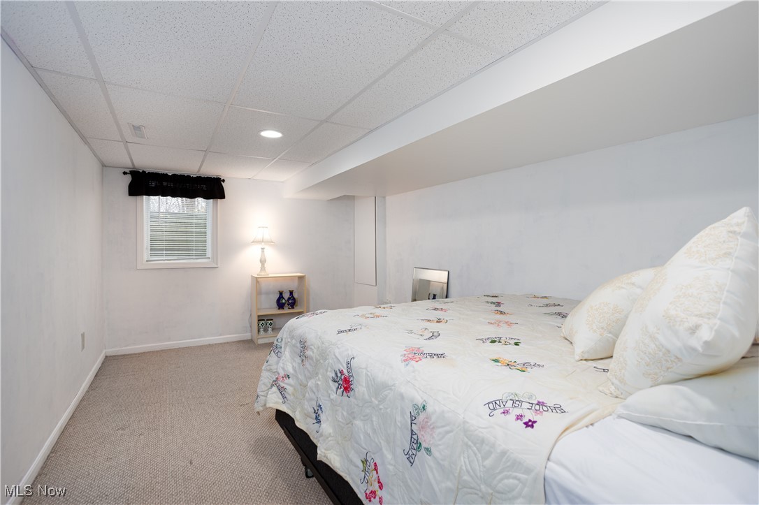 7317 Beach Road Wadsworth, OH 44281 - Photo 23 of 42 Carpeted bedroom with a paneled ceiling