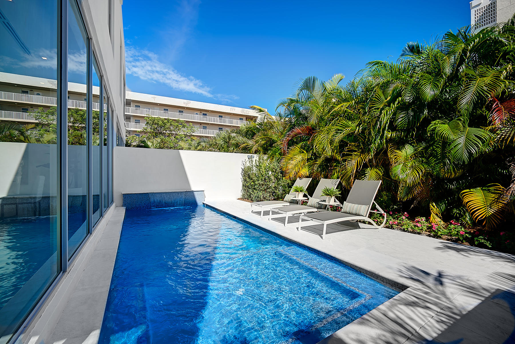 3092 Banyan Road, Unit A Boca Raton, FL 33432 - Photo 24 of 49 a view of a balcony with chairs and wooden floor