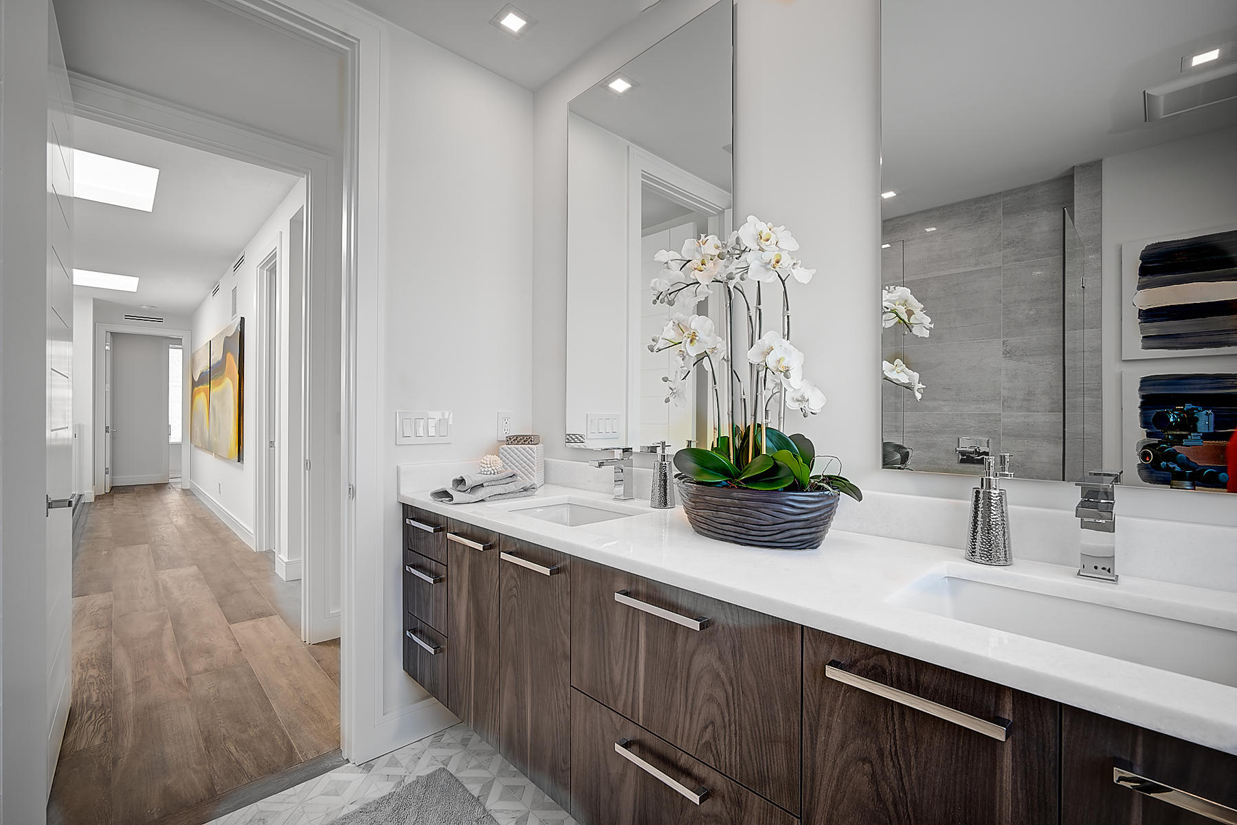 3092 Banyan Road, Unit A Boca Raton, FL 33432 - Photo 28 of 49 a bathroom with a double vanity sink and a mirror