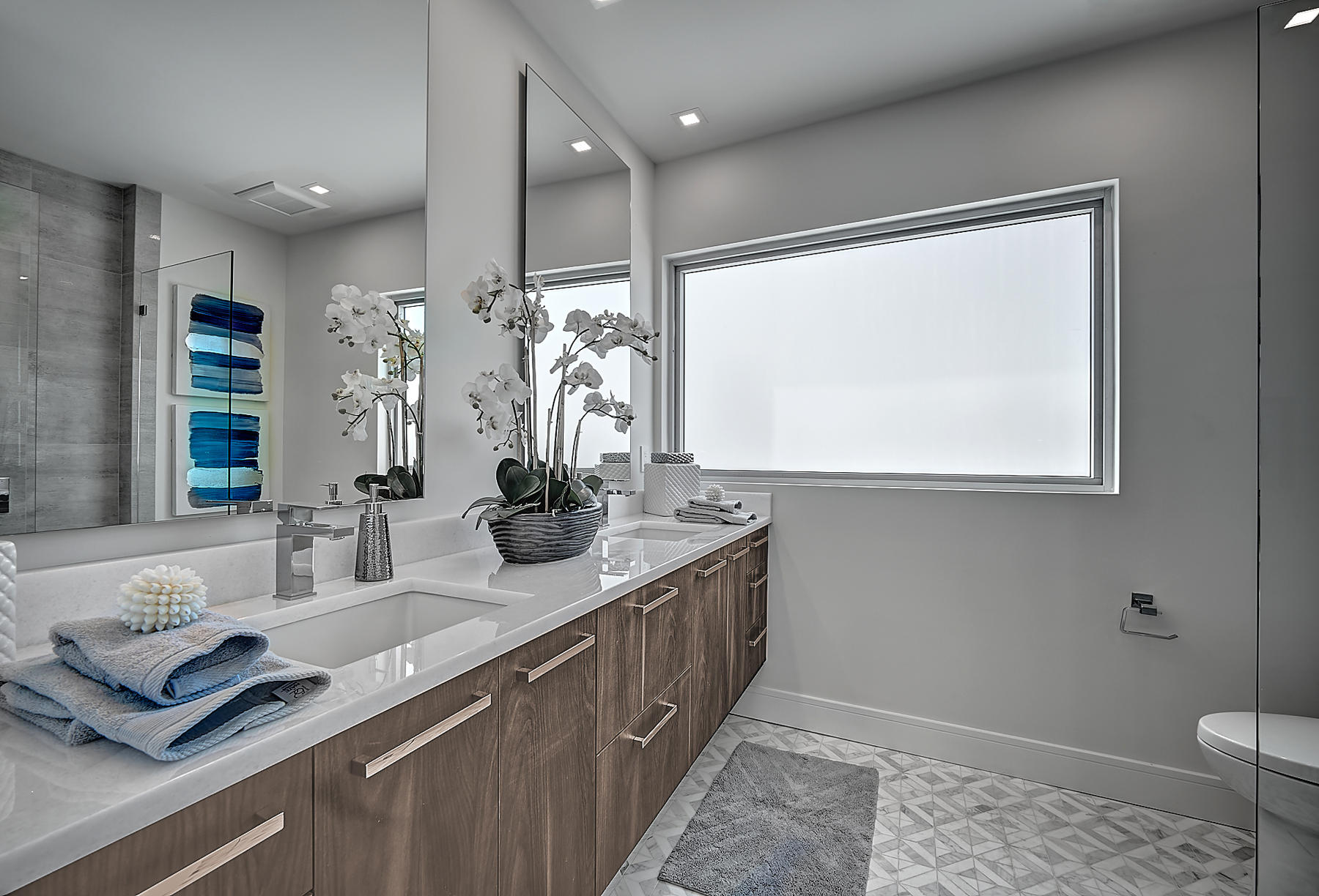 3092 Banyan Road, Unit A Boca Raton, FL 33432 - Photo 29 of 49 a hallway with sink and mirror