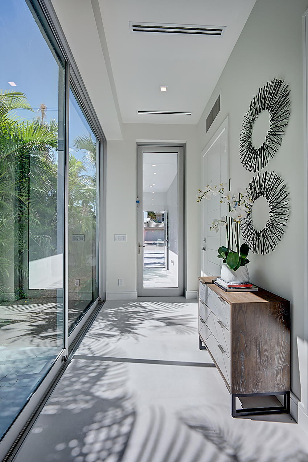 3092 Banyan Road, Unit A Boca Raton, FL 33432 - Photo 8 of 49 a bedroom with furniture and window