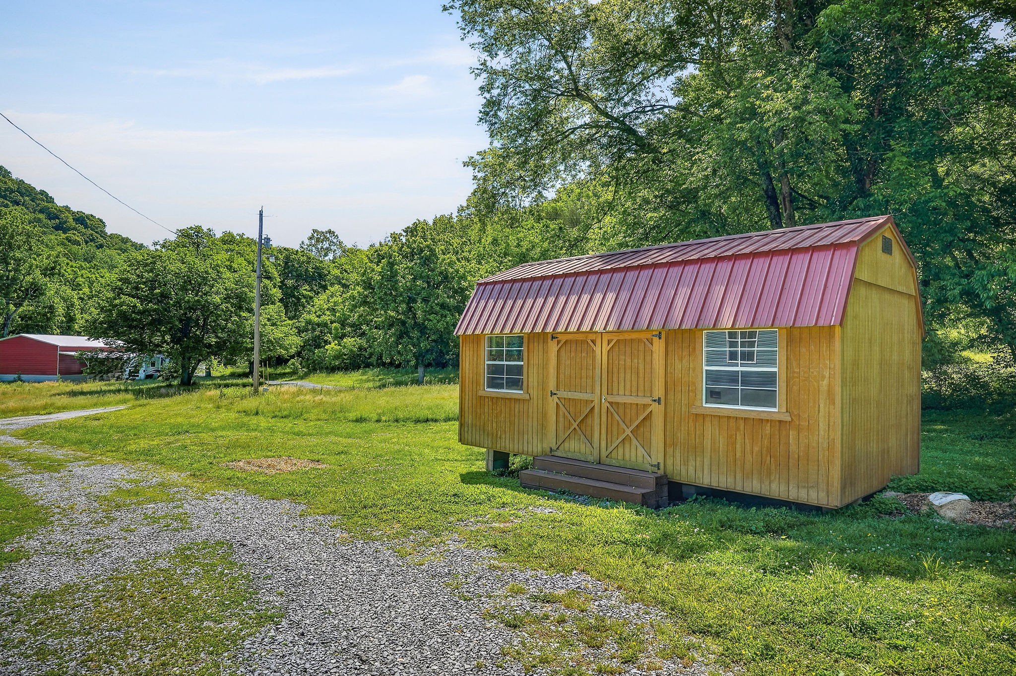 16062 Buffalo Valley Road Silver Point, TN 38582 - Photo 23 of 27 a view of a backyard with a garden