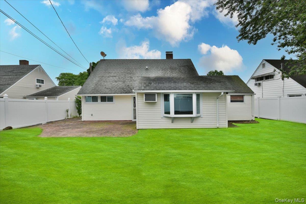 307 Blacksmith Road Levittown, NY 11756 - Photo 24 of 27 a aerial view of a house with a yard and a garage