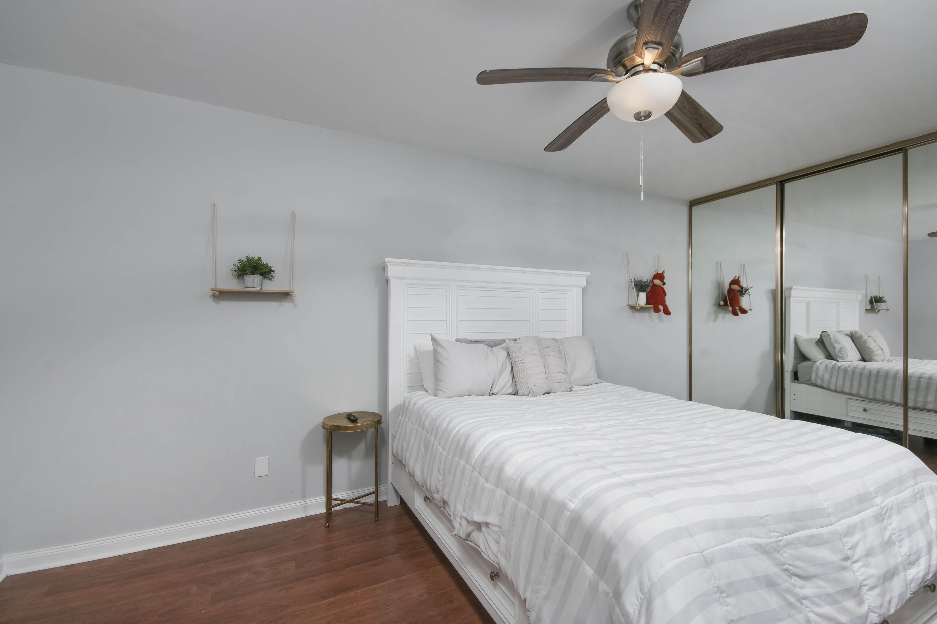 4603 Roxbury Court Boynton Beach, FL 33436 - Photo 12 of 19 a bedroom with a bed and a chandelier