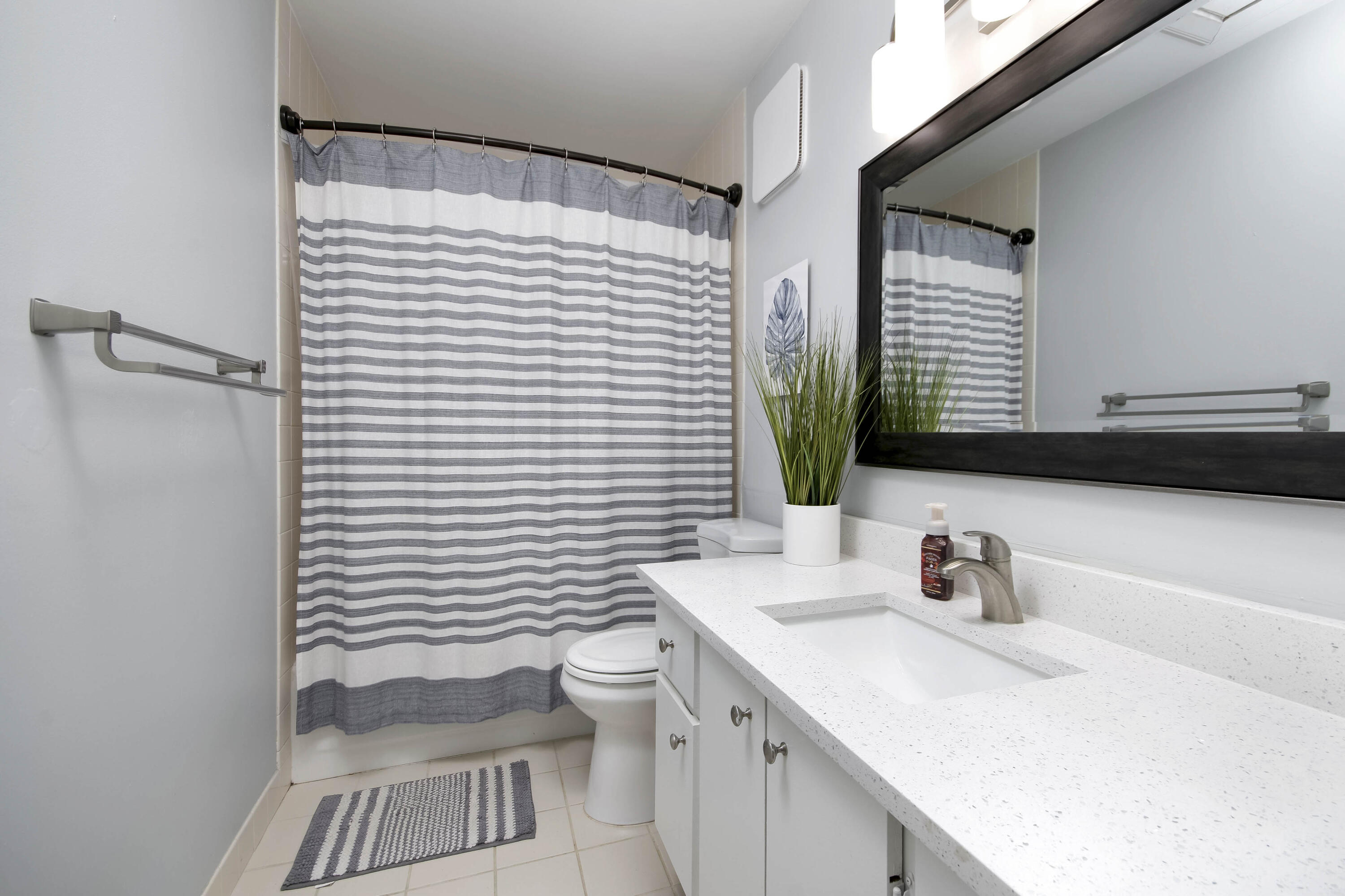 4603 Roxbury Court Boynton Beach, FL 33436 - Photo 13 of 19 a bathroom with a sink toilet and mirror