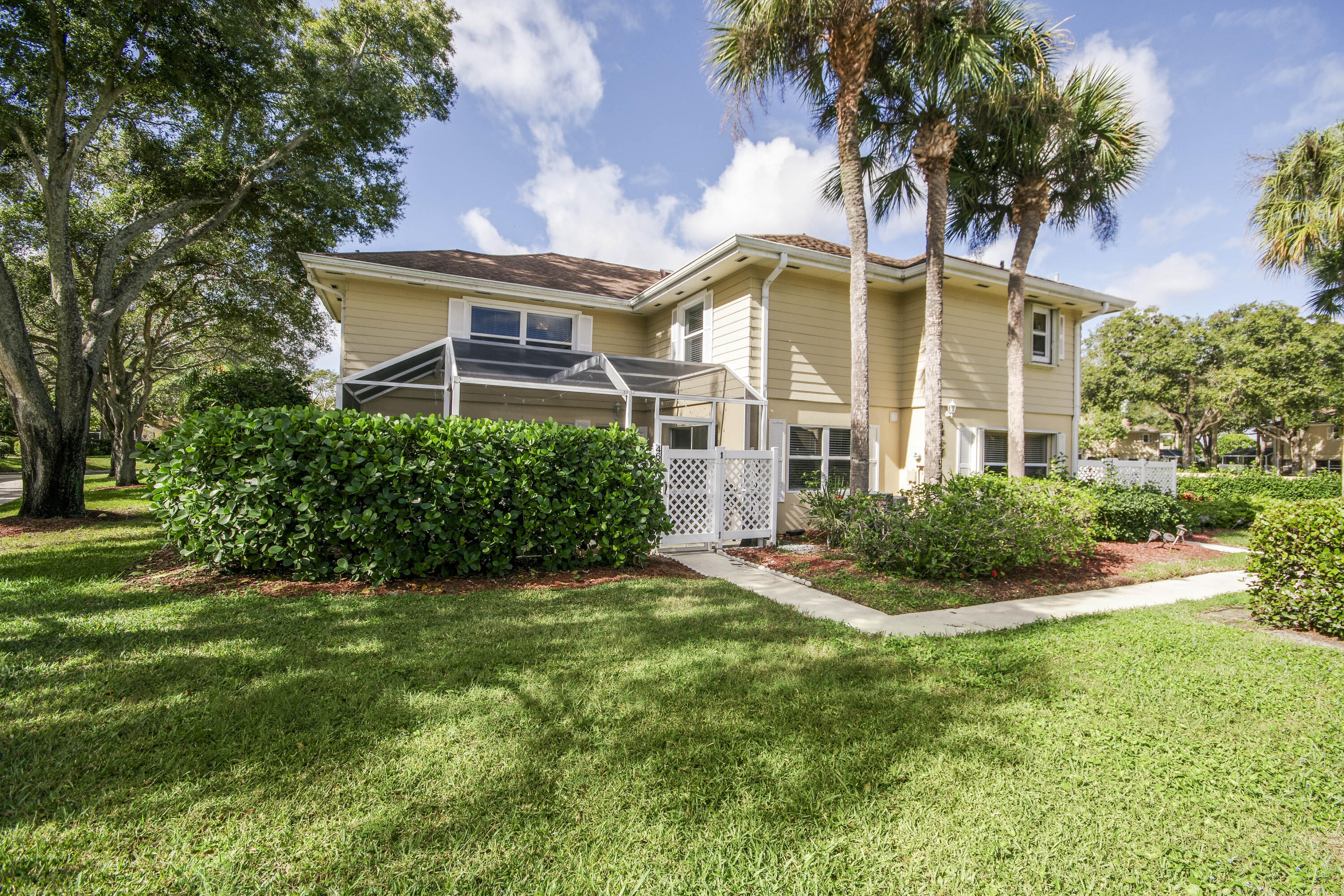 4603 Roxbury Court Boynton Beach, FL 33436 - Photo 15 of 19 a front view of a house with a yard