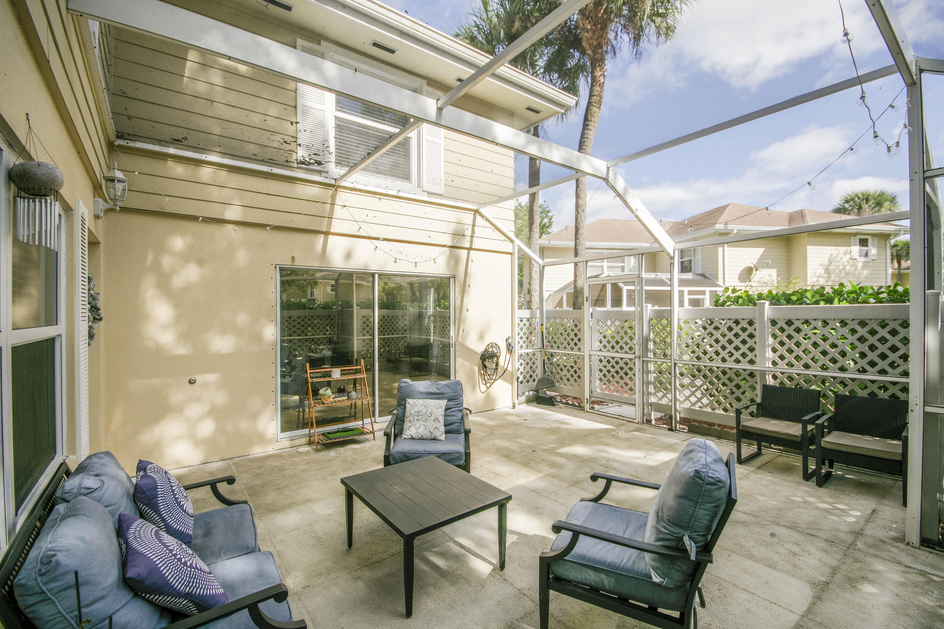 4603 Roxbury Court Boynton Beach, FL 33436 - Photo 5 of 19 a outdoor living space with patio furniture and a potted plant