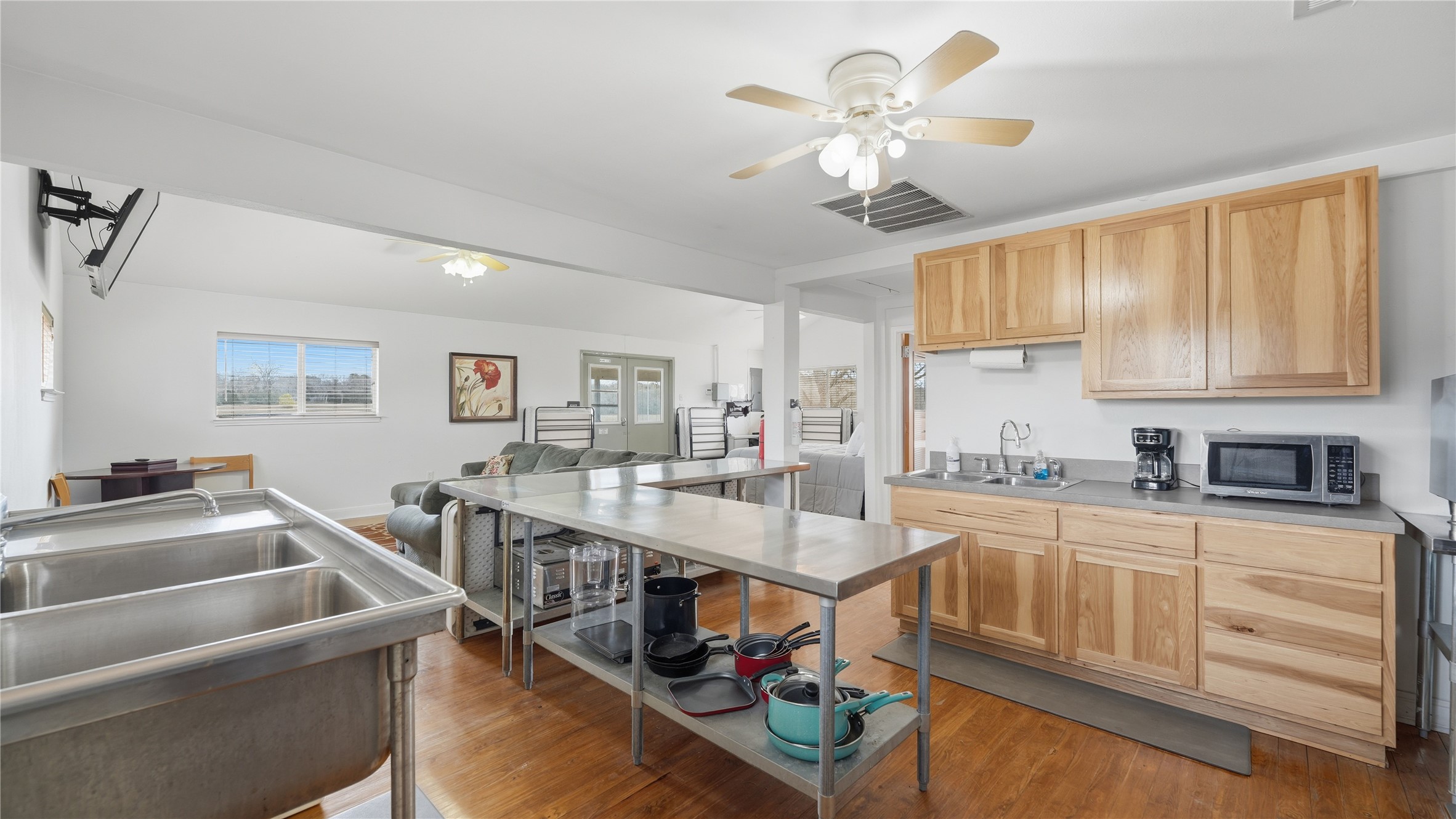 218 Little Ranch Road, Unit E Red Rock, TX 78662 - Photo 11 of 22 Kitchen featuring ceiling fan, light wood finish cabinetry, and light wood-type flooring