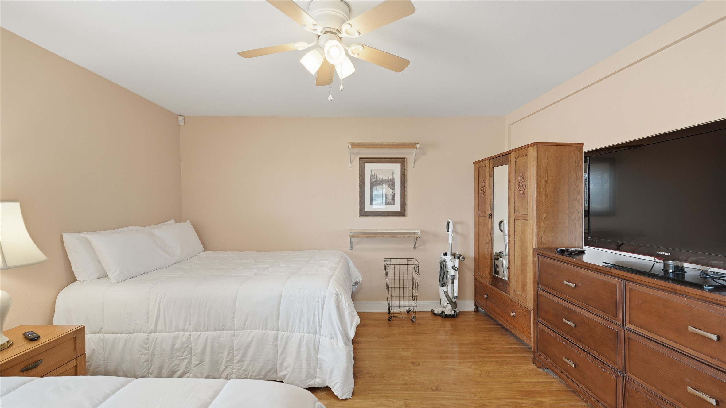 218 Little Ranch Road, Unit E Red Rock, TX 78662 - Photo 17 of 22 Bedroom featuring light wood-style floors and ceiling fan