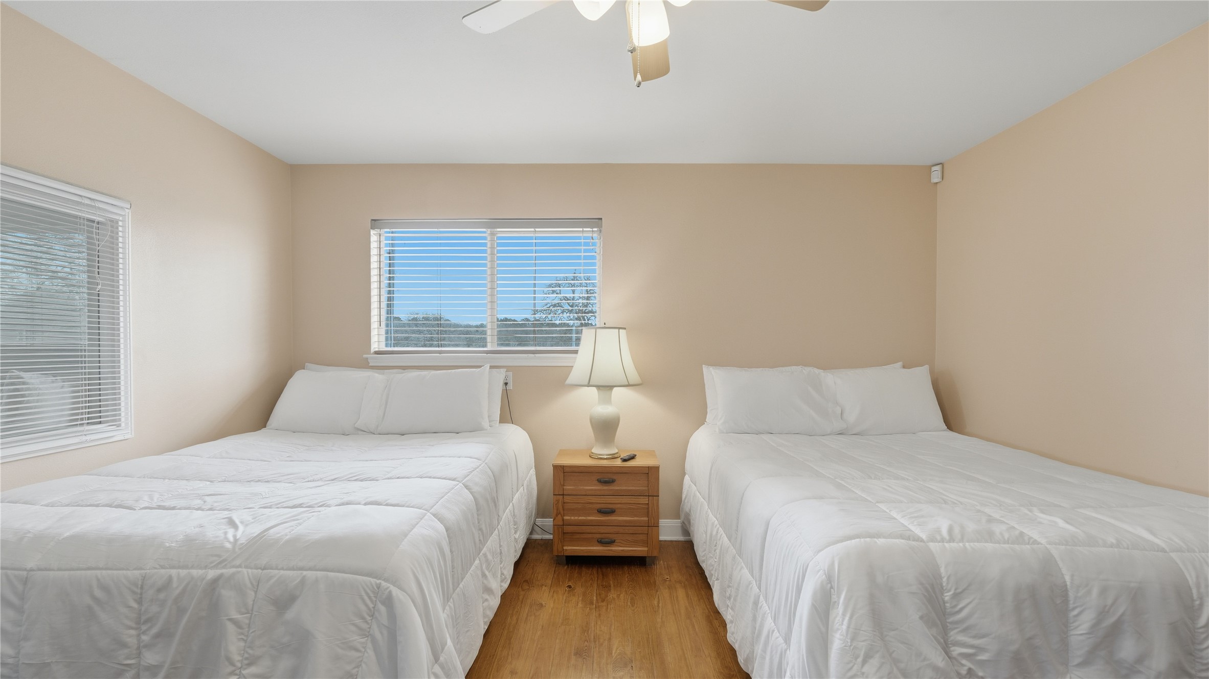 218 Little Ranch Road, Unit E Red Rock, TX 78662 - Photo 18 of 22 Bedroom featuring wood finished floors and ceiling fan