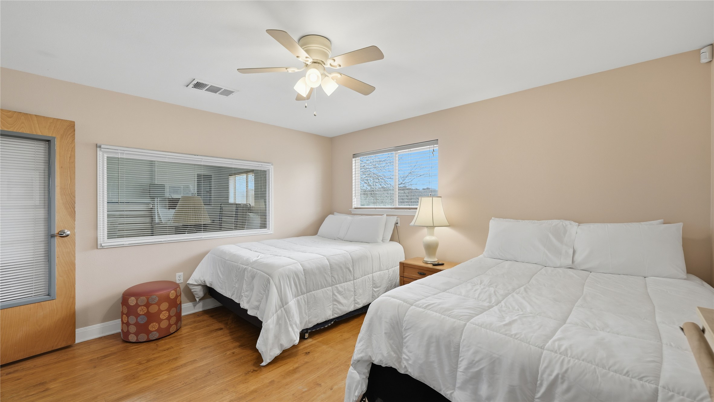 218 Little Ranch Road, Unit E Red Rock, TX 78662 - Photo 8 of 22 Bedroom with light wood finished floors and ceiling fan