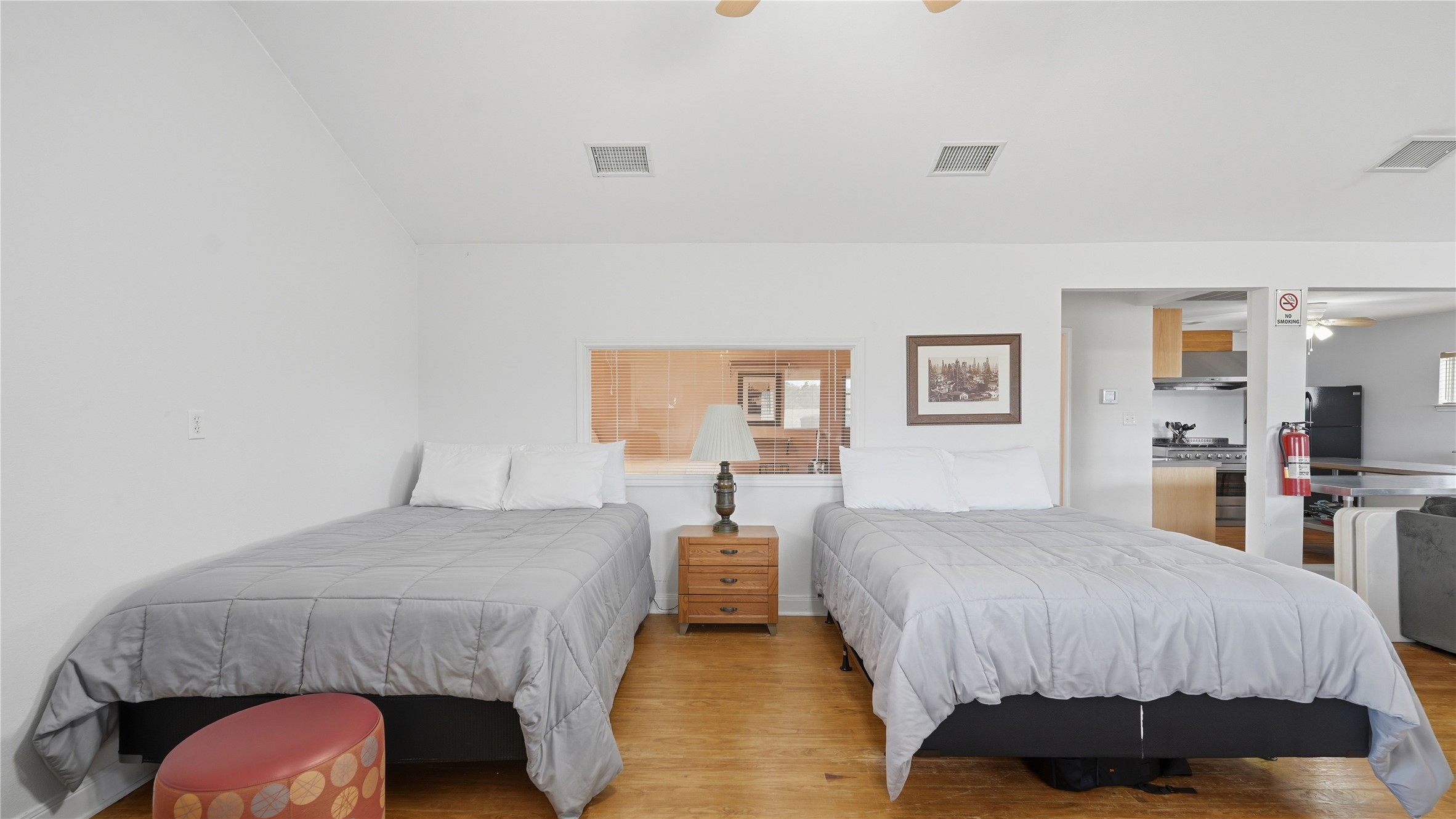 218 Little Ranch Road, Unit E Red Rock, TX 78662 - Photo 9 of 22 Bedroom with wood finished floors, ceiling fan, and lofted ceiling