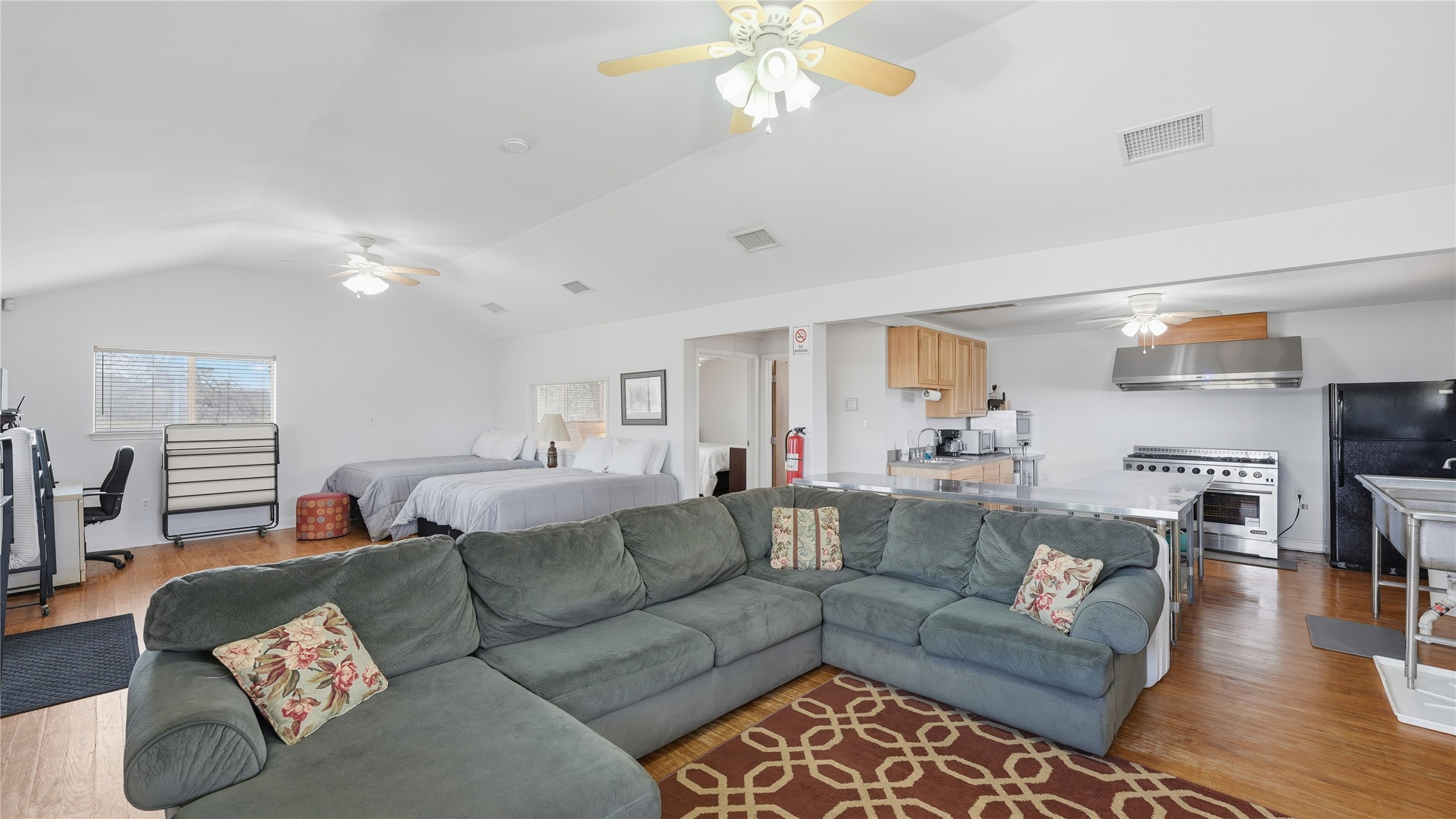 218 Little Ranch Road, Unit E Red Rock, TX 78662 - Photo 10 of 22 Living area with light wood-style flooring and ceiling fan