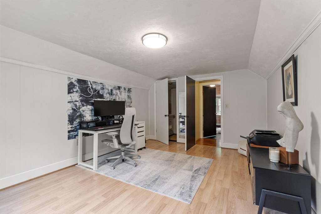 167 Gates Pond Road Berlin, MA 01503 - Photo 28 of 32 a view of a workspace with furniture and a flat screen tv