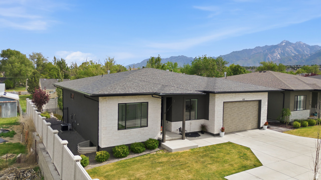 653 East Vandalay Lane Draper, UT 84020 - Photo 51 of 61 Contemporary ranch-style residence featuring a dark gray facade with white brick accents
