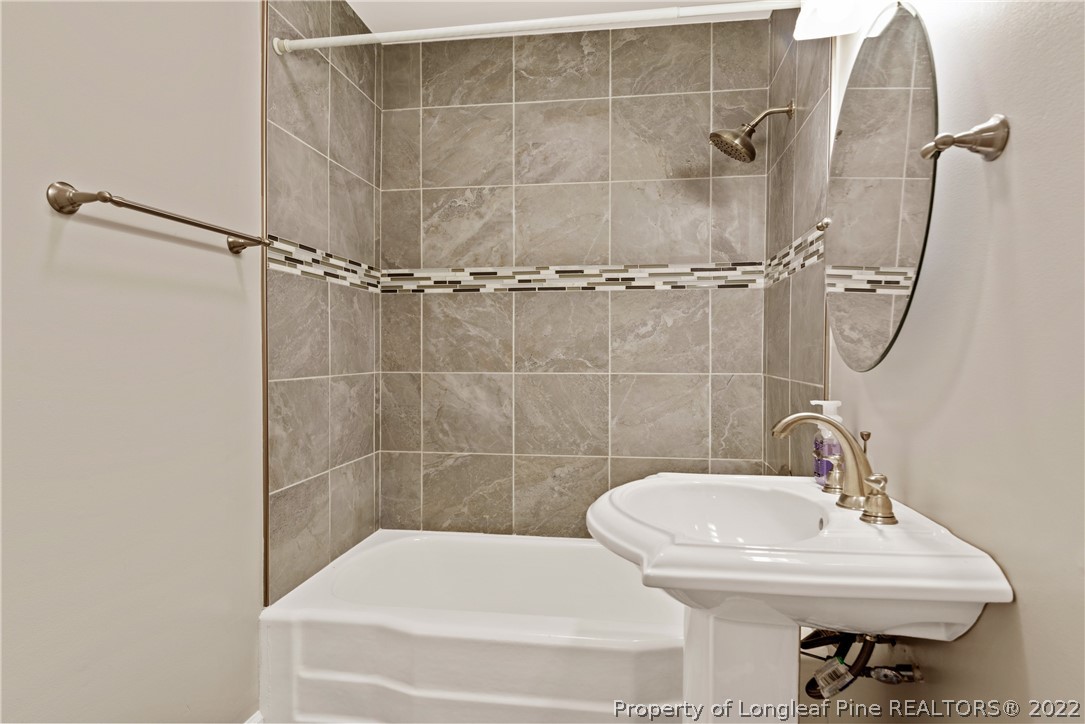 400 Rush Road Fayetteville, NC 28305 - Photo 28 of 37 a bathroom with a sink toilet and shower