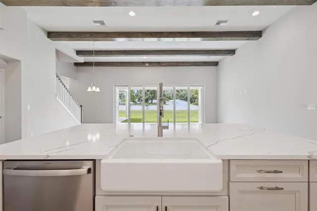a view of bathroom with bathtub and windows