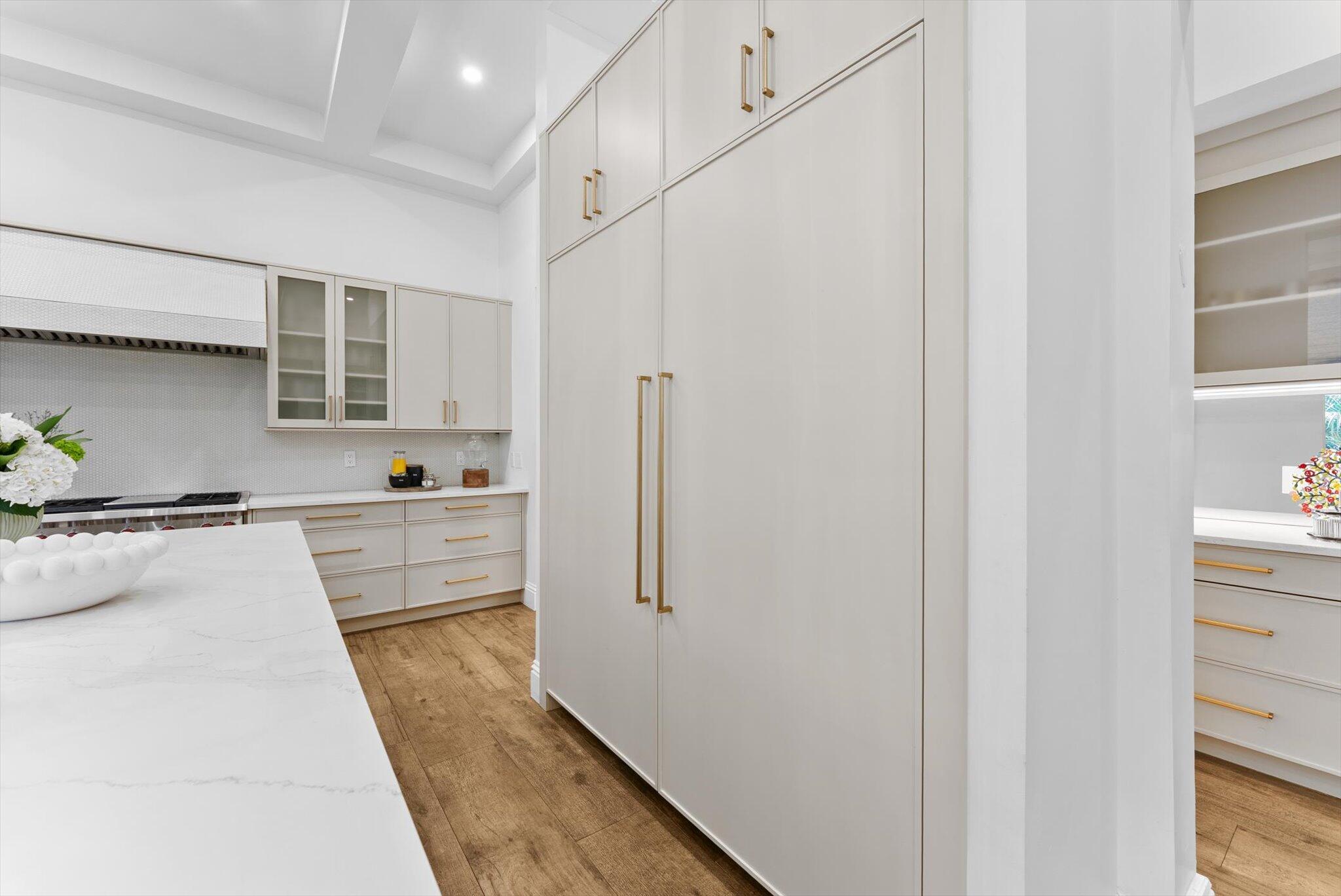 7955 Mandarin Drive Boca Raton, FL 33433 - Photo 13 of 74 a kitchen with stainless steel appliances a refrigerator sink and cabinets