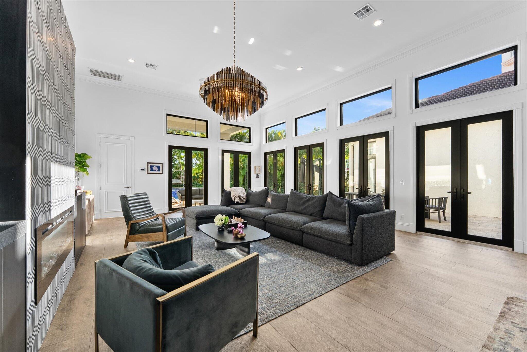 7955 Mandarin Drive Boca Raton, FL 33433 - Photo 18 of 74 a living room with furniture and a large window