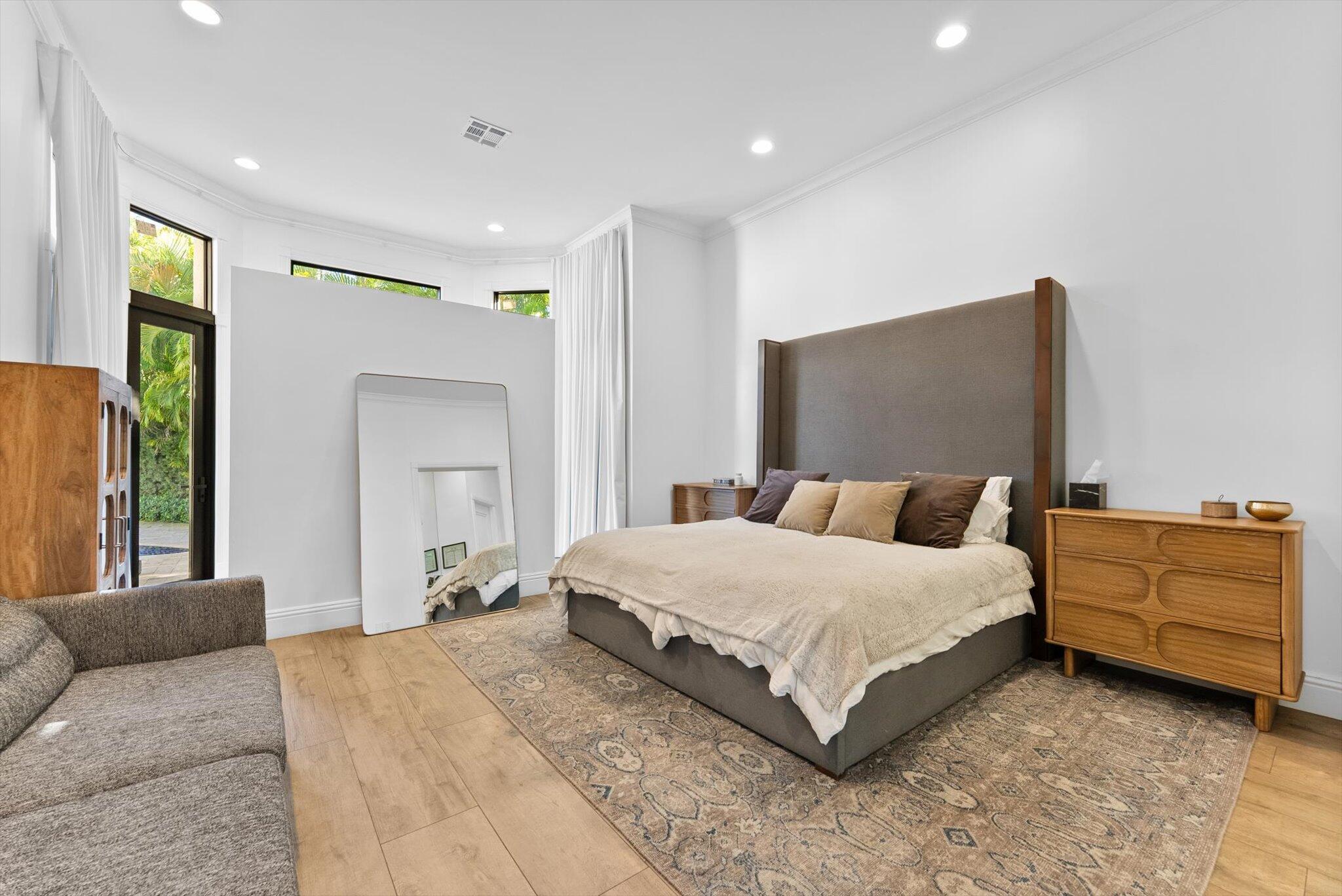 7955 Mandarin Drive Boca Raton, FL 33433 - Photo 22 of 74 a bedroom with a large bed and a couch