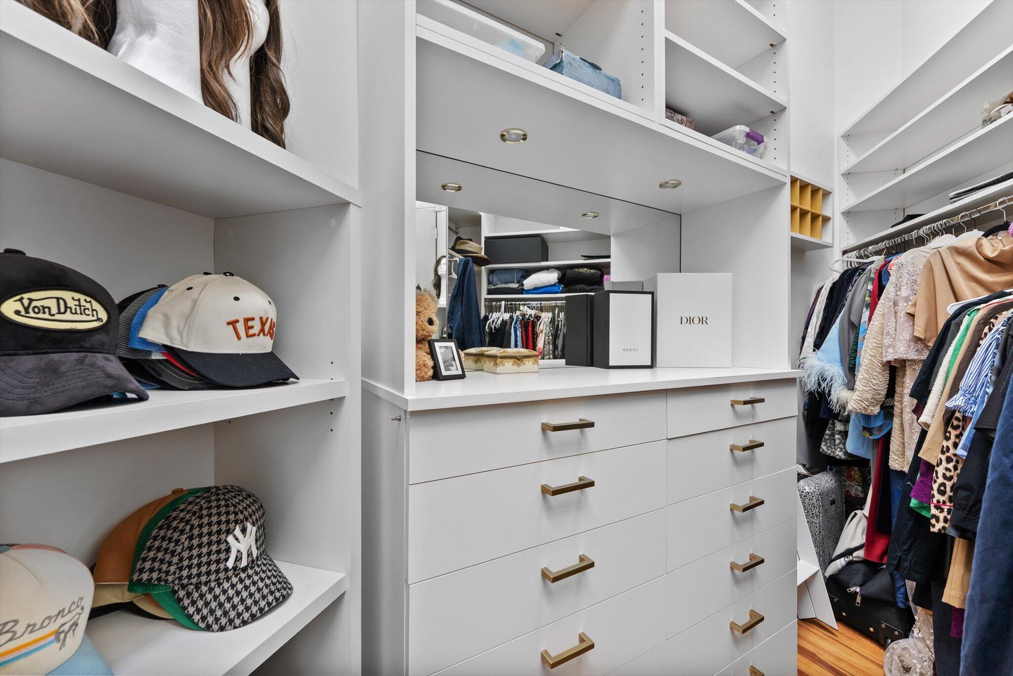 7955 Mandarin Drive Boca Raton, FL 33433 - Photo 26 of 74 a view of walk in closet with clothes and shoes