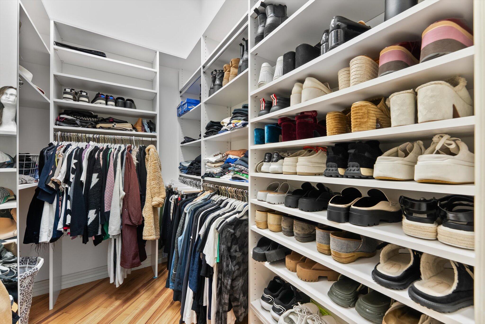 7955 Mandarin Drive Boca Raton, FL 33433 - Photo 27 of 74 a view of walk in closet with clothes and shoes