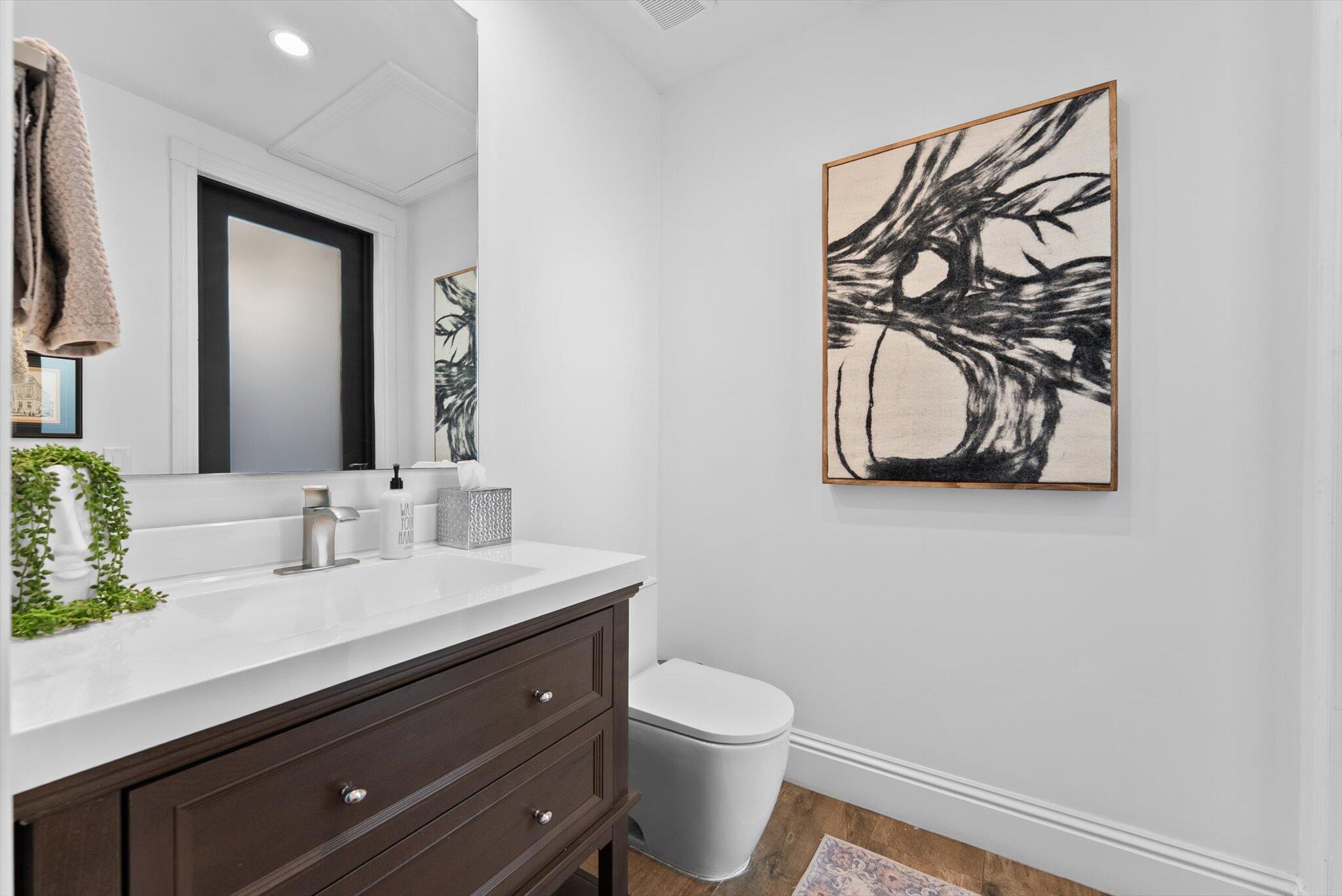 7955 Mandarin Drive Boca Raton, FL 33433 - Photo 34 of 74 a bathroom with a toilet sink and mirror