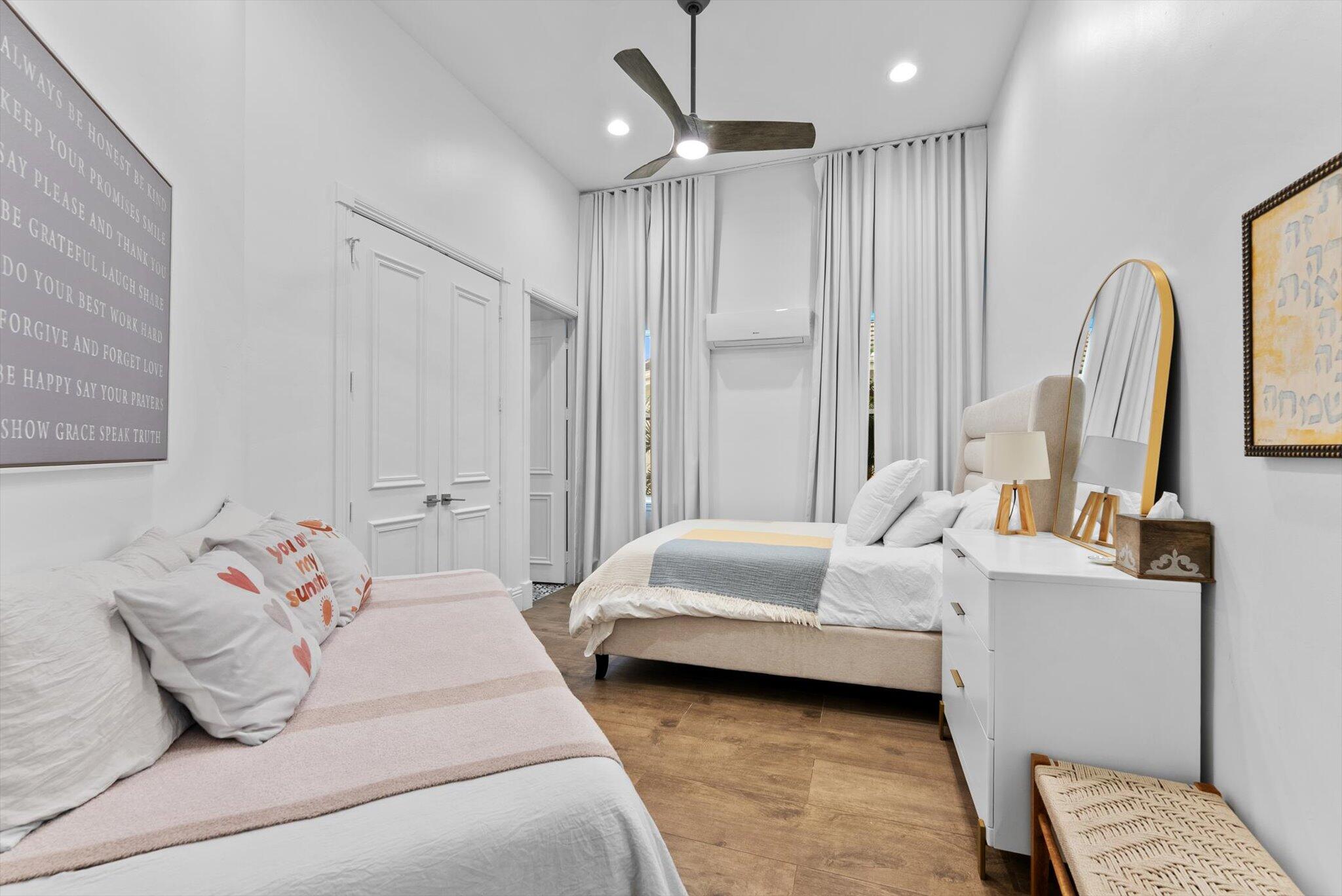 7955 Mandarin Drive Boca Raton, FL 33433 - Photo 35 of 74 a bedroom with a bed couch and a window