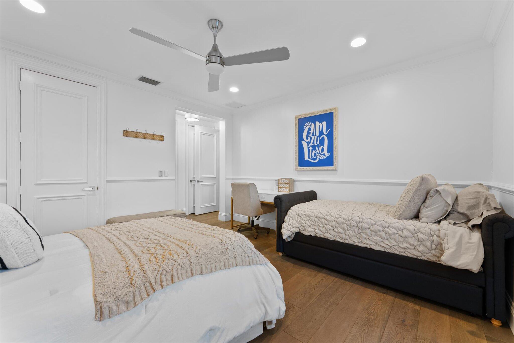 7955 Mandarin Drive Boca Raton, FL 33433 - Photo 41 of 74 a bedroom with two beds and painting on the wall