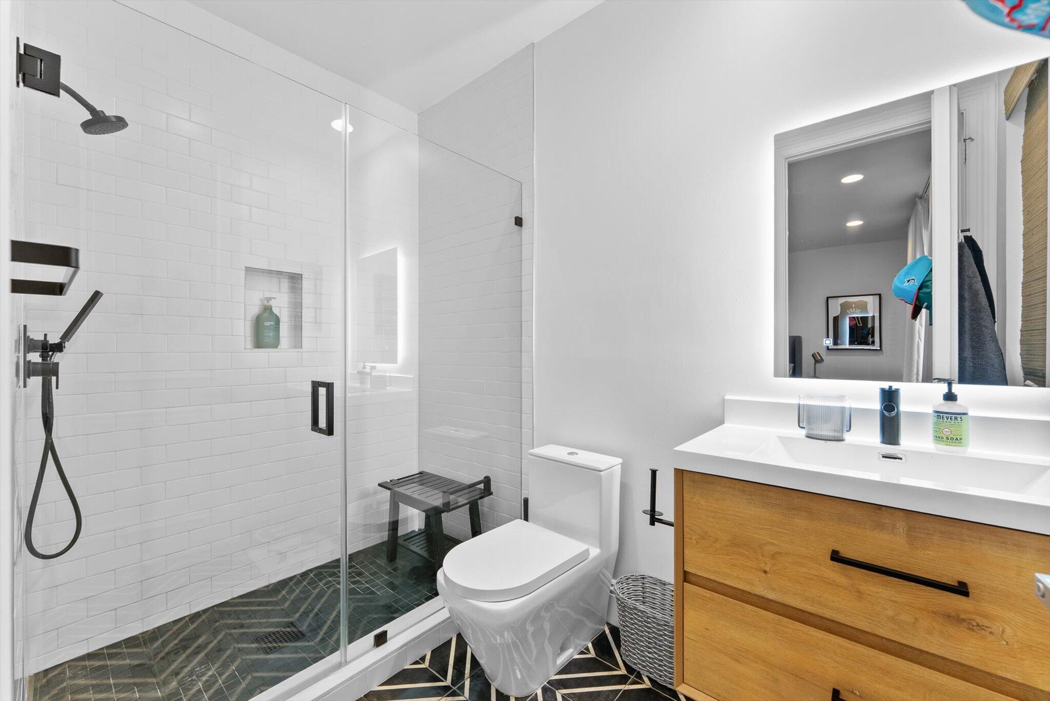 7955 Mandarin Drive Boca Raton, FL 33433 - Photo 46 of 74 a bathroom with a sink toilet and shower