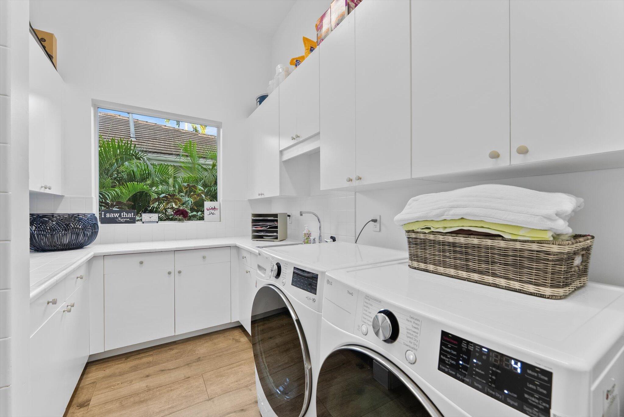 7955 Mandarin Drive Boca Raton, FL 33433 - Photo 52 of 74 a utility room with dryer and washer