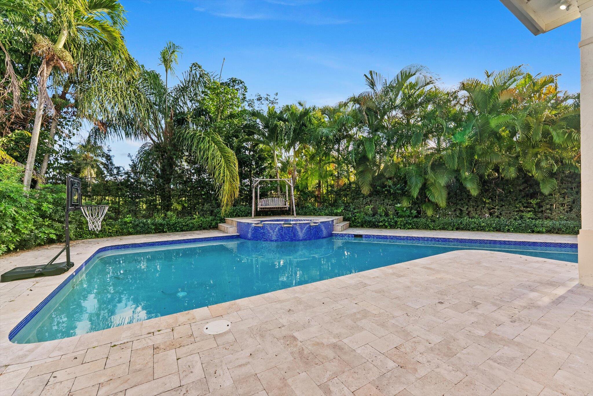 7955 Mandarin Drive Boca Raton, FL 33433 - Photo 56 of 74 a view of a swimming pool and trees