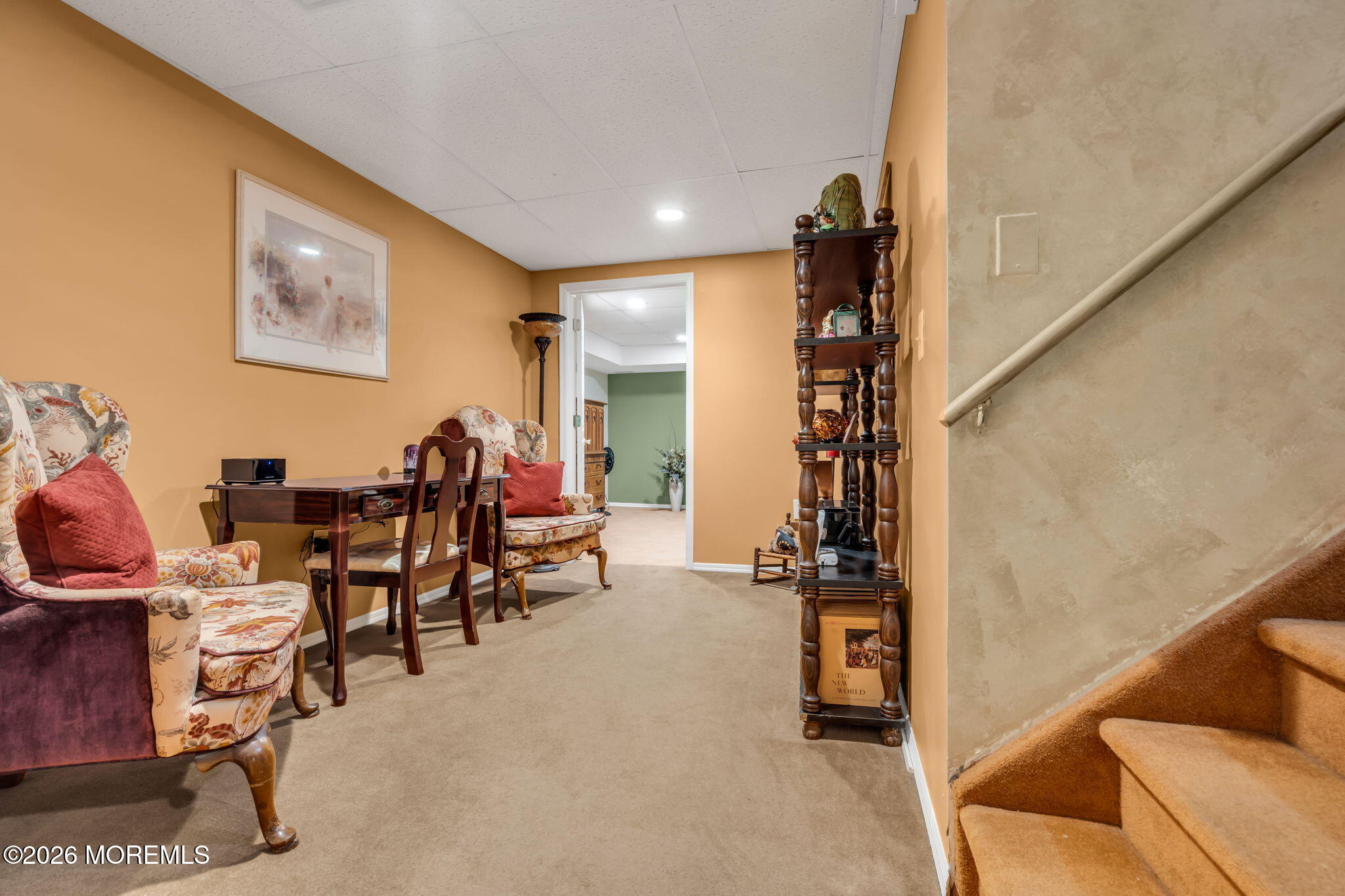 21 Ryan Road Marlboro, NJ 07746 - Photo 35 of 56 a room with lots of chairs and mirrors