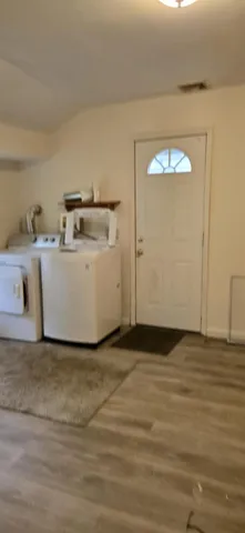 a view of kitchen and empty room