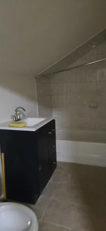 a bathroom with a bathtub and a sink